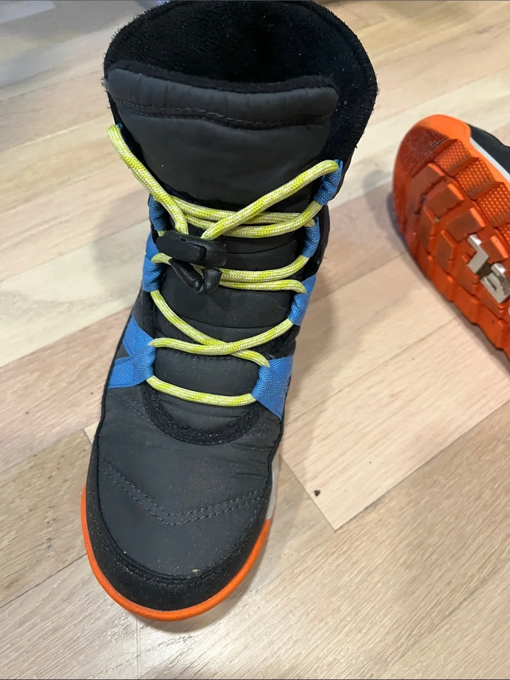 Sorel Kids Black Boots with Blue Stripes and Orange Sole